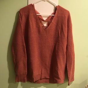 Pink sweater w/ delicate cross lacing on the back